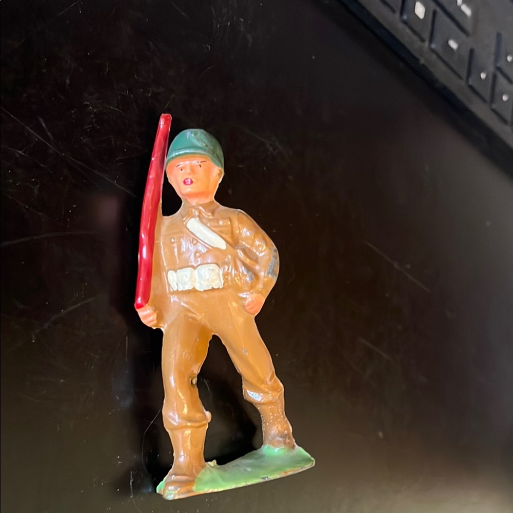 Dynamic Red and Green Warrior Figurine